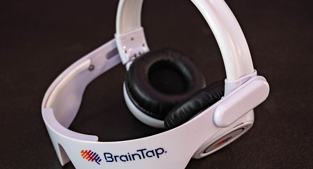 woman wearing BrainTap device