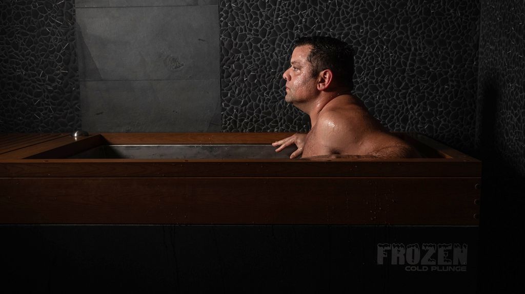 man utilizing the cold plunge at SoulSpace in Cleveland for health benefits