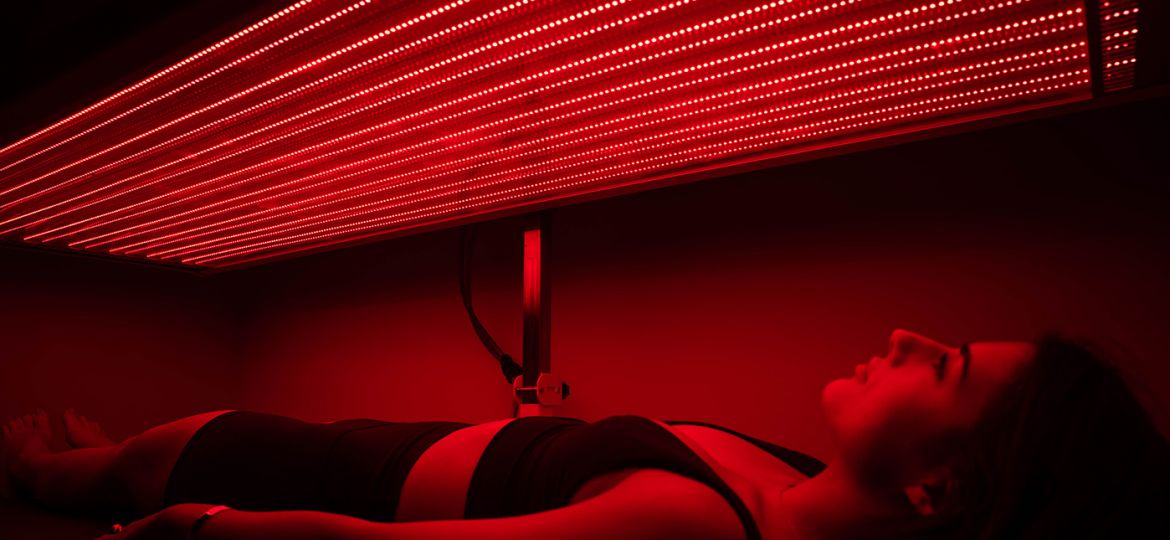 woman in red light therapy session in cleveland