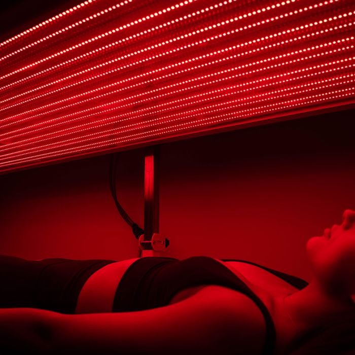 woman in red light therapy session in cleveland
