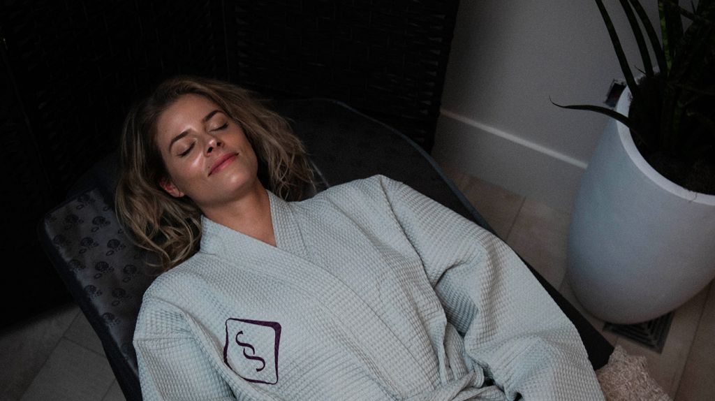 woman in soulspace robe enjoying a relaxing wellness day in cleveland