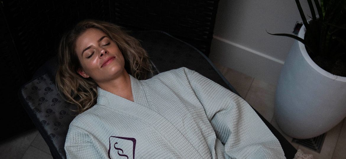 woman in soulspace robe enjoying a relaxing wellness day in cleveland