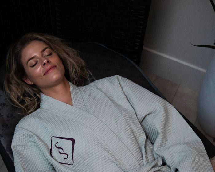 woman in soulspace robe enjoying a relaxing wellness day in cleveland