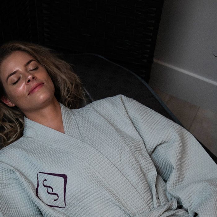 woman in soulspace robe enjoying a relaxing wellness day in cleveland