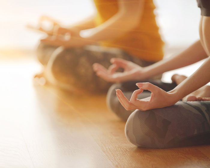 women practicing yoga in Cleveland as a part of communal healing