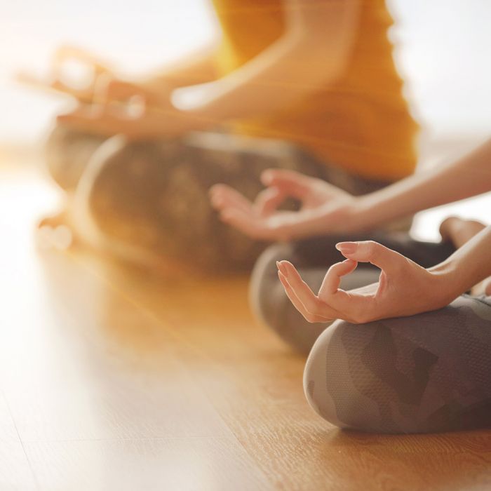 women practicing yoga in Cleveland as a part of communal healing