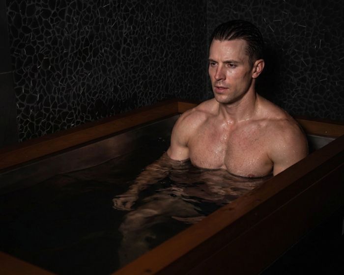 male athlete recovering in cold plunge session